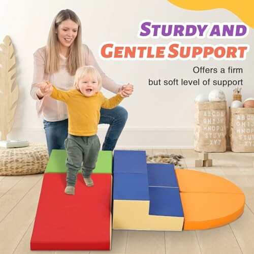 Toddler walking on colorful foam mats with adult support.